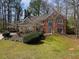 Charming brick home with a well-manicured lawn and mature trees in a serene, wooded setting at 3851 Westwick Nw Way, Kennesaw, GA 30152