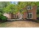 Attractive brick facade with large windows, a welcoming front door, and well-maintained landscaping at 3851 Westwick Nw Way, Kennesaw, GA 30152