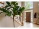 Bright foyer with hardwood front door, large windows, tile floor, and staircase at 3851 Westwick Nw Way, Kennesaw, GA 30152