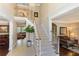 Grand foyer featuring a staircase, chandelier, tile flooring, and views into adjoining living spaces at 3851 Westwick Nw Way, Kennesaw, GA 30152