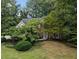Charming two-story brick home with manicured lawn and mature landscaping at 3851 Westwick Nw Way, Kennesaw, GA 30152