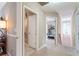 Neutral-toned hallway leading to a workout room, featuring modern lighting and clean finishes at 3851 Westwick Nw Way, Kennesaw, GA 30152