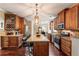 Gourmet kitchen with granite counters, stainless steel appliances, custom cabinetry, and an island with seating at 3851 Westwick Nw Way, Kennesaw, GA 30152
