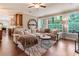 Bright living room with hardwood floors, comfortable seating, and large windows overlooking the outdoors at 3851 Westwick Nw Way, Kennesaw, GA 30152