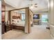 Spacious main bedroom boasting a beamed ceiling, neutral carpet, a canopy bed, and large windows at 3851 Westwick Nw Way, Kennesaw, GA 30152