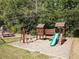 Community playground with a slide, tire swing, swingsets, and a picnic bench for outdoor fun at 3851 Westwick Nw Way, Kennesaw, GA 30152