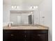 Bathroom with double vanity, granite counters and dark wood cabinets at 372 Mulberry Se Row, Atlanta, GA 30354