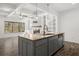 Kitchen island with granite countertop, pendant lighting, and stainless steel appliances at 372 Mulberry Se Row, Atlanta, GA 30354