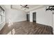 Main bedroom with ceiling fan, windows, and wall-mounted TV at 372 Mulberry Se Row, Atlanta, GA 30354