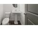 Powder room featuring a pedestal sink, neutral wall color and flooring at 372 Mulberry Se Row, Atlanta, GA 30354
