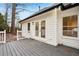 View of the back of the home and the wooden deck at 4554 Alaspair Ln, Acworth, GA 30101