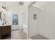 Modern bathroom featuring a double vanity, soaking tub, and a glass-enclosed shower with white subway tile at 4554 Alaspair Ln, Acworth, GA 30101