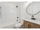 Modern bathroom with a tub/shower combo and patterned wood vanity at 4554 Alaspair Ln, Acworth, GA 30101