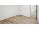 Clean bedroom featuring luxury vinyl floors, closet doors and a hallway entry at 4554 Alaspair Ln, Acworth, GA 30101