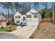 Two-story home with a manicured front lawn and two-car garage at 4554 Alaspair Ln, Acworth, GA 30101