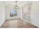 Light filled hallway with white railings and wood-look floors at 4554 Alaspair Ln, Acworth, GA 30101