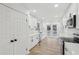 Modern kitchen featuring white cabinets, quartz countertops, and stainless appliances at 4554 Alaspair Ln, Acworth, GA 30101