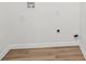 Laundry room with hookups and hardwood floors at 4554 Alaspair Ln, Acworth, GA 30101