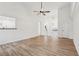 Open concept living room with hardwood floors, vaulted ceilings and a view of the kitchen at 4554 Alaspair Ln, Acworth, GA 30101