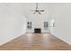 Spacious living room with hardwood floors, a fireplace, large windows, and vaulted ceilings at 4554 Alaspair Ln, Acworth, GA 30101