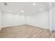 Well-lit living room with hardwood floors and recessed lighting at 4554 Alaspair Ln, Acworth, GA 30101