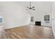 Bright living room with hardwood floors, vaulted ceilings and a fireplace with white mantel at 4554 Alaspair Ln, Acworth, GA 30101