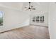 Serene main bedroom featuring hardwood floors, recessed lighting, and large windows with backyard views at 4554 Alaspair Ln, Acworth, GA 30101