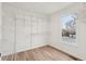 Spacious walk-in closet with ample shelving, storage and a window at 4554 Alaspair Ln, Acworth, GA 30101