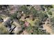 Aerial view featuring a house with a barn and a lush wooded lot within a neighborhood at 5190 Paul Sw Cir, Conyers, GA 30094