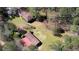 Aerial view of house with barn shows well-maintained lawn and lush surrounding greenery at 5190 Paul Sw Cir, Conyers, GA 30094