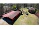 A long barn is adjacent to a house on a lush, verdant lawn at 5190 Paul Sw Cir, Conyers, GA 30094
