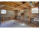Unfinished basement with concrete floors, wooden shelves, cinder block walls, and natural light from windows at 5190 Paul Sw Cir, Conyers, GA 30094