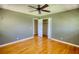 Bedroom with hardwood floors, a closet, and an entry door at 5190 Paul Sw Cir, Conyers, GA 30094