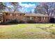 Charming brick home with large front yard and mature trees, perfect for outdoor enjoyment at 5190 Paul Sw Cir, Conyers, GA 30094
