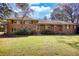 Charming brick home with large front yard and mature trees, perfect for outdoor enjoyment at 5190 Paul Sw Cir, Conyers, GA 30094
