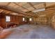 Spacious garage with wood frame, concrete floor, work benches, and windows offering natural light at 5190 Paul Sw Cir, Conyers, GA 30094