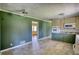 View of open kitchen features two-tone cabinets, tile flooring, and green walls at 5190 Paul Sw Cir, Conyers, GA 30094