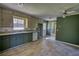 Spacious kitchen featuring vinyl tile flooring and green walls at 5190 Paul Sw Cir, Conyers, GA 30094