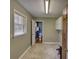 Spacious laundry room featuring vinyl flooring, cabinetry, and an open doorway to the bathroom at 5190 Paul Sw Cir, Conyers, GA 30094