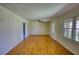 Spacious living room with hardwood floors and large windows at 5190 Paul Sw Cir, Conyers, GA 30094