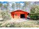Outbuilding on a landscaped lot with driveway at 5190 Paul Sw Cir, Conyers, GA 30094