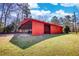 Exterior side yard and shed showing open bay for parking and additional storage at 5190 Paul Sw Cir, Conyers, GA 30094