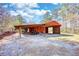 Exterior angle of shed showing open bay for parking and additional storage at 5190 Paul Sw Cir, Conyers, GA 30094