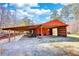 Exterior angle of shed showing open bay for parking and additional storage at 5190 Paul Sw Cir, Conyers, GA 30094