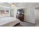 Main bedroom features carpet, natural light, and ceiling fan at 928 Gate Post Ln, Lawrenceville, GA 30044