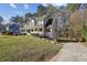 Beautiful home showcasing a spacious yard and long driveway, perfect for outdoor activities and gatherings at 928 Gate Post Ln, Lawrenceville, GA 30044