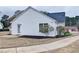 Backyard with minimal landscaping, grassy area, and vinyl siding at 732 Jacoby Dr, Loganville, GA 30052
