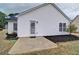Backyard with minimal landscaping, grassy area, and vinyl siding at 732 Jacoby Dr, Loganville, GA 30052