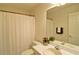 Bright bathroom features tile floors, single sink vanity, and shower at 732 Jacoby Dr, Loganville, GA 30052
