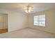 Carpeted bedroom with window and ceiling fan at 732 Jacoby Dr, Loganville, GA 30052
